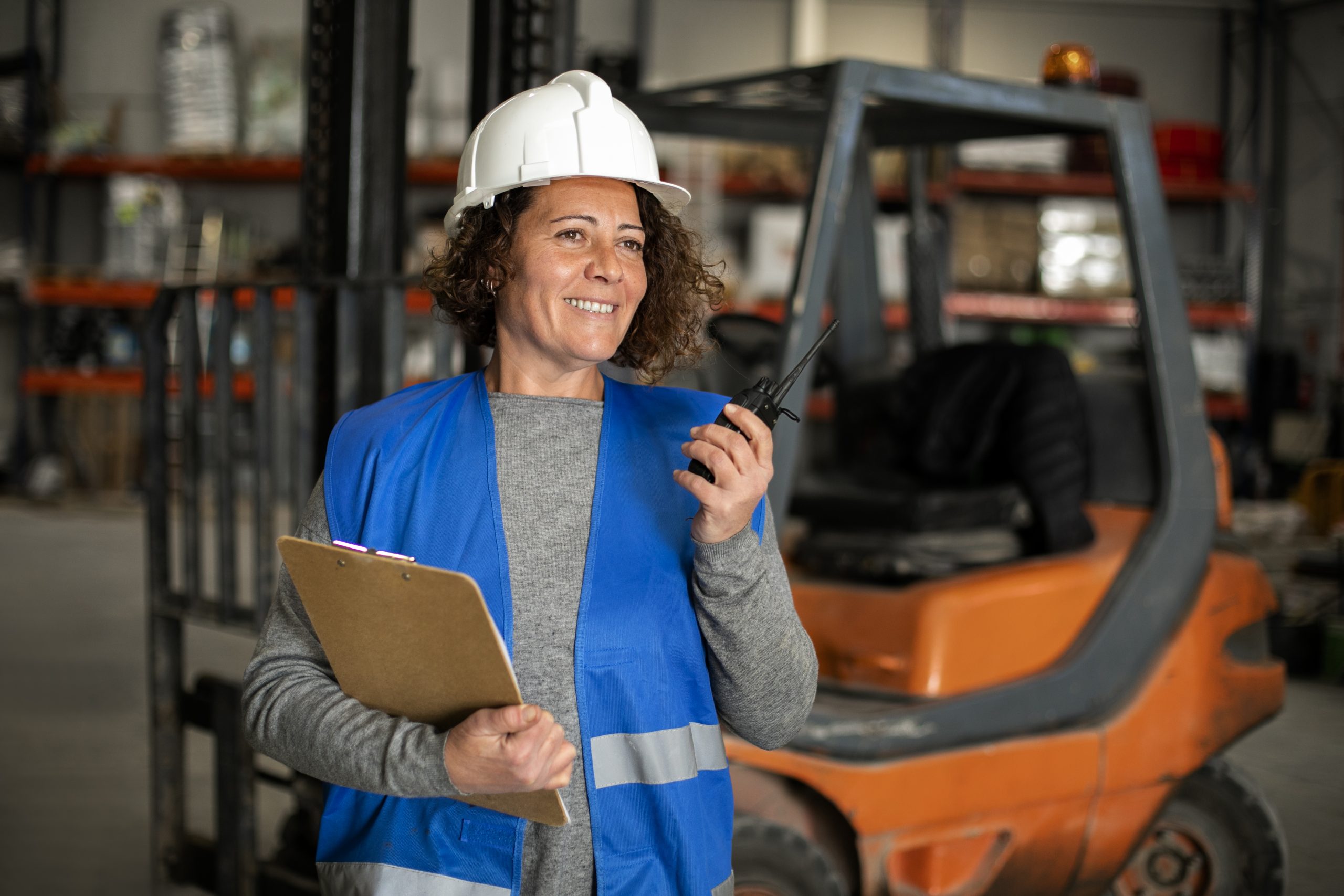 professional-female-driver-operating-forklift-vehicle professional-female-driver-operating-forklift-vehicle